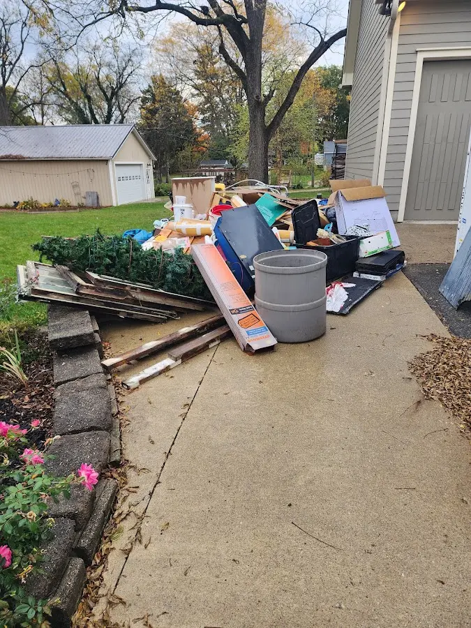 Dumpster being loaded with debris for Commercial Dumpster Rental in Talent